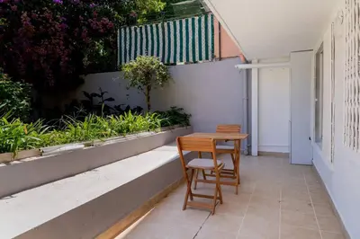 a small table and two chairs on a patio at 2BR Designed Flat In The Center of Buyukada in Adalar