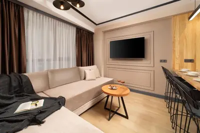 a living room with a couch and a table at Şişli Family Time Suites in Istanbul