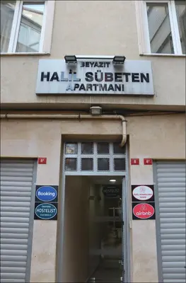 a building with a sign above the entrance to a restaurant at Hostelist in Istanbul