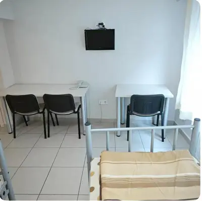 a room with a table and two chairs and a table at Hostelist in Istanbul