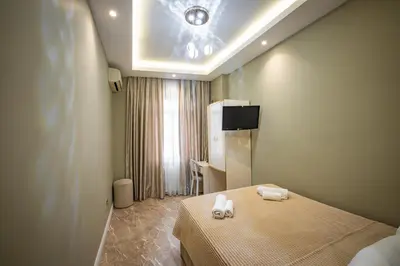 a bedroom with a bed with two towels on it at Hotel Flash in Istanbul