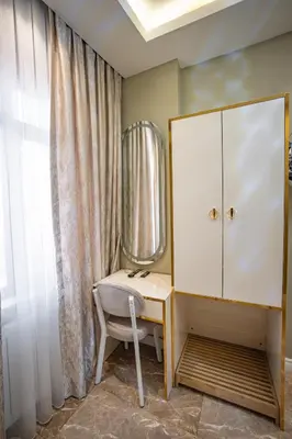 a dressing room with a mirror and a chair at Hotel Flash in Istanbul