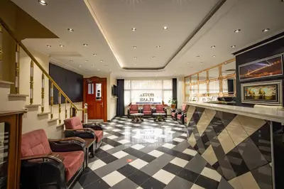 a lobby with couches and chairs in a building at Hotel Flash in Istanbul