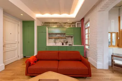 a living room with a couch and green cabinets at Liberty Residence in Istanbul