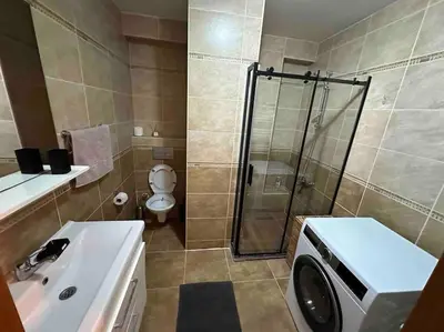 a bathroom with a shower and a toilet and a sink at Dublex roof top with AC, perfect location in Istanbul