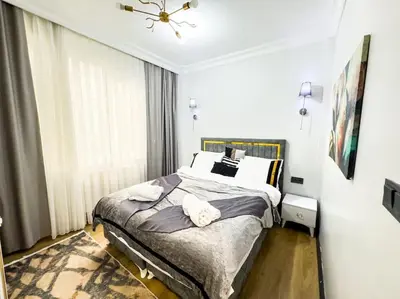 a bedroom with a bed with two towels on it at شقه الأحلام بمنطقة شيشلى 341 in Istanbul