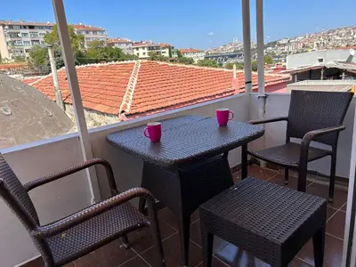 a table and chairs on a balcony with a view at i1 House Hotel in Istanbul