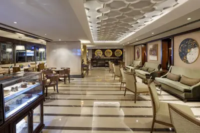a restaurant with chairs and tables and a lobby at Titanic City Taksim in Istanbul