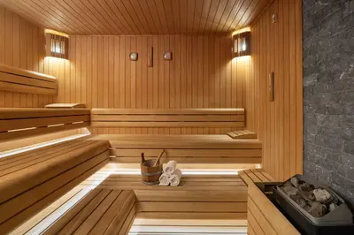 a sauna with a teddy bear sitting in it at Titanic City Taksim in Istanbul