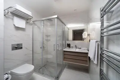 a bathroom with a shower and a toilet and a sink at Me by Mula in Istanbul