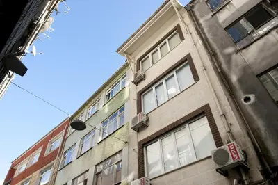 a tall building with windows on the side of it at Spacious Balcony Suite Sultanahmet - Aslan Apartments in Istanbul