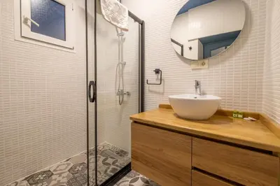 a bathroom with a sink and a shower at Mayer Beyoglu Apartments in Istanbul