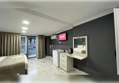 a hotel room with a bed and a sink and a mirror at Anka Boutique Hotel in Istanbul