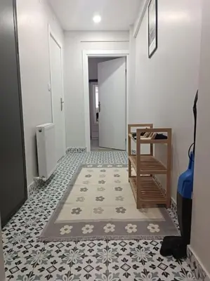 a hallway with a room with a tile floor at Evinizin Konforunu Yaşayın ! in Istanbul