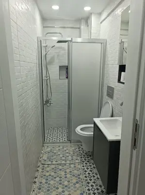 a bathroom with a shower and a toilet and a sink at Evinizin Konforunu Yaşayın ! in Istanbul