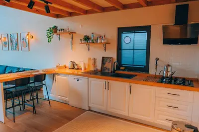 a kitchen with white cabinets and a sink and a counter at Villa Ulusoy Sapanca in Sapanca