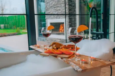 two glasses of red wine and a plate of food at Villa Ulusoy Sapanca in Sapanca