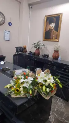 a room with two baskets of flowers on a table at Cemre Homes in Istanbul