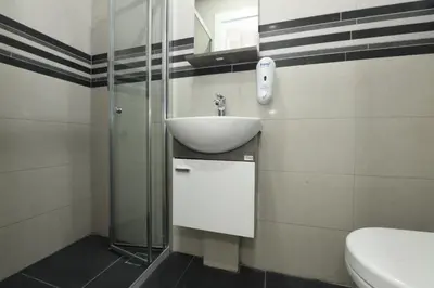 a bathroom with a sink and a toilet at Uzay Apartments in Istanbul