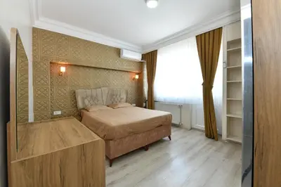 a bedroom with a bed and a large window at Dogancay Suite in Istanbul