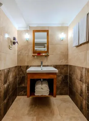 a bathroom with a sink and a mirror at Hamit Hotel Istanbul - Special Category in Istanbul