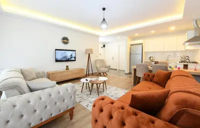 a living room with a couch and a table at Perihan Apartments in Istanbul