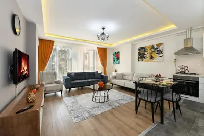 a living room with a couch and a table at Perihan Apartments in Istanbul