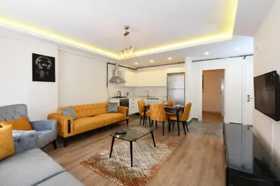 a living room with a couch and a table at Kardes Apartment in Istanbul