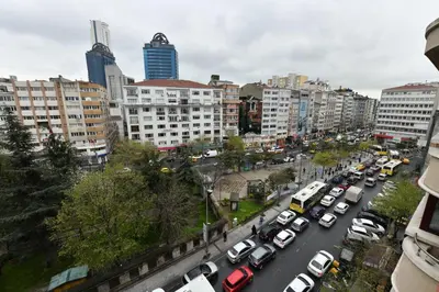 a busy city street filled with cars and buildings at Sevim Apartment in Istanbul