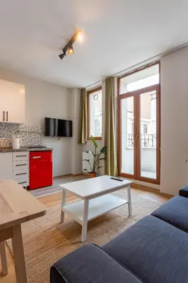 a living room with a couch and a table at Lovely and Snug Flat, Just Steps from Istiklal Street in Istanbul