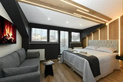 a bedroom with a bed and a couch at Space Apartments in Istanbul