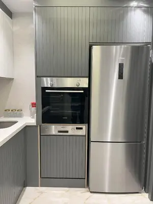 a stainless steel refrigerator and an oven in a kitchen at Ruzi's House in Istanbul