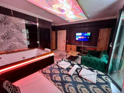 a room with a pool table and a tv at Neo Suit I Hotel in Istanbul
