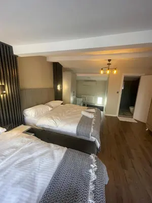 a hotel room with two beds in a room at Golden Arrow delüx Dublex in Istanbul