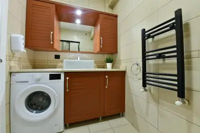 a laundry room with a washer and dryer in it at Bomonti Apartments in Istanbul