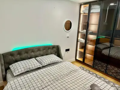 a bedroom with a bed and a glass closet at İstanbul buluşma noktası in Istanbul