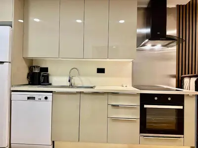 a kitchen with white cabinets and a sink at İstanbul buluşma noktası in Istanbul