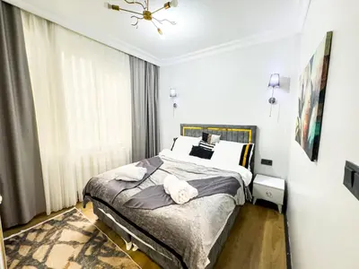 a bedroom with a bed with two towels on it at Sisli Holiday 4412 in Istanbul