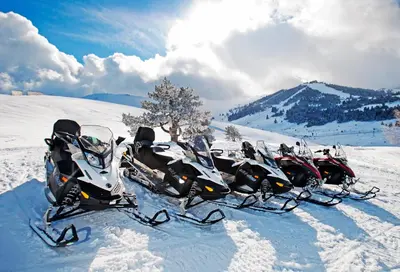 a group of snowmobiles parked in the snow at Ağaoğlu My Mountain in Uludag