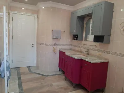 a bathroom with a red sink and a mirror at Kilyos Serendipity in Sarıyer