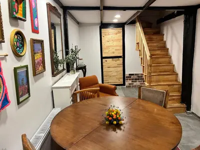 a dining room with a wooden table and chairs at Central 5 Bedroom 5 Bathroom, Newly Renovated Villa at the heart of the city in Istanbul