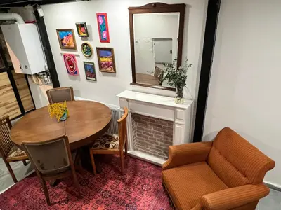 a dining room with a table and a mirror at Central 5 Bedroom 5 Bathroom, Newly Renovated Villa at the heart of the city in Istanbul