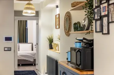 a hallway with a living room with a tv at Respiro Rooms in Istanbul