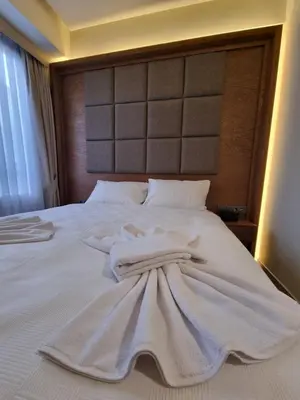 a bed with white towels on top of it at RIJJI HOTEL ISTANBUL OLD CiTY in Istanbul