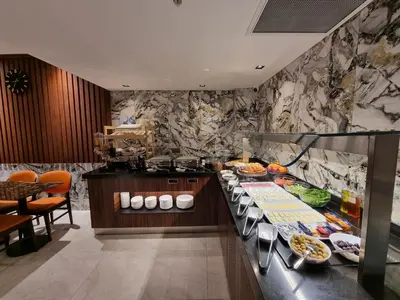 a kitchen with a buffet with food on it at RIJJI HOTEL ISTANBUL OLD CiTY in Istanbul