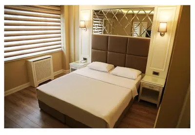 a small bedroom with a bed and a window at Fimka Hotel in Istanbul