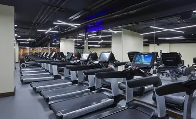 a gym with rows of treadmills and machines at Uranus Istanbul Topkapi in Istanbul