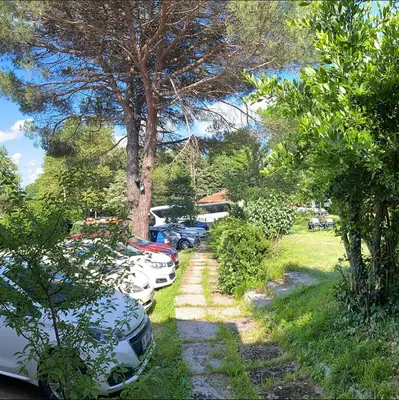 a row of parked cars parked in a yard at Rahat bahçeli polonezköyde butik evimiz in Beykoz