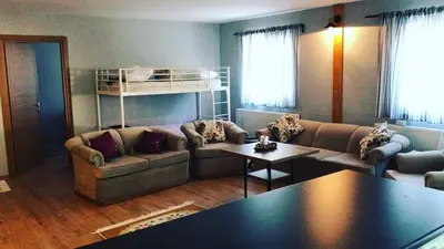 a living room with a couch and a table at Rahat bahçeli polonezköyde butik evimiz in Beykoz