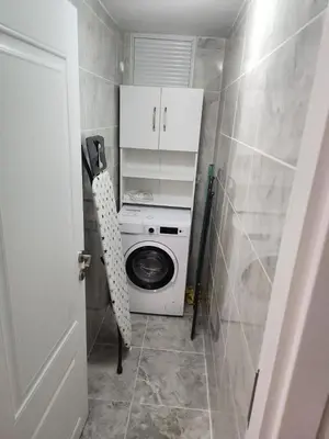 a washer and dryer in a small bathroom at KADIKOY merkezi konumda in Istanbul